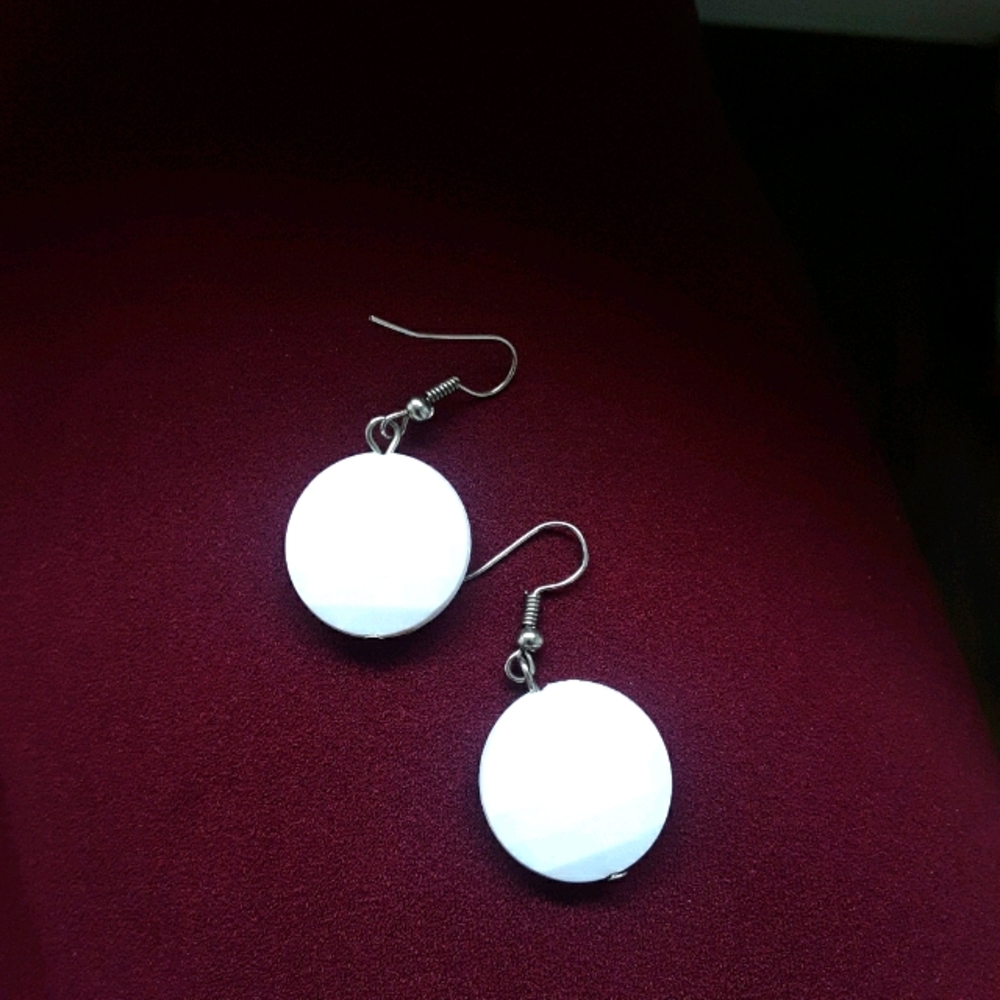 White circled earrings